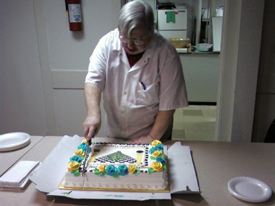 John cuts the cake
